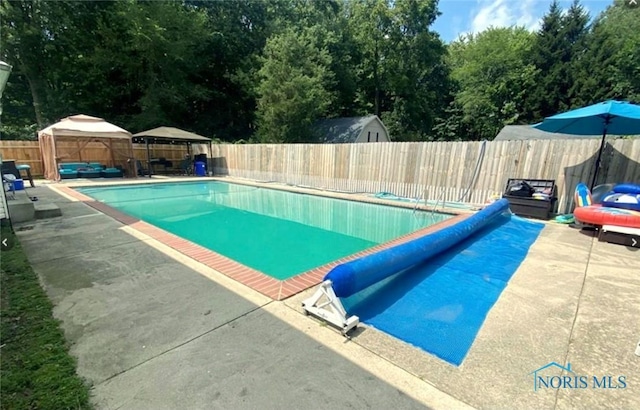 2249 Woods Edge Ct, Toledo, OH 43615 - view of pool featuring a gazebo, a fenced in pool, a fenced backyard, and a patio