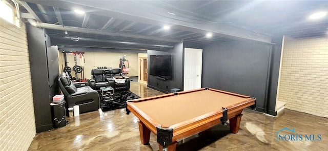 2249 Woods Edge Ct, Toledo, OH 43615 - playroom featuring billiards, brick wall, and concrete floors
