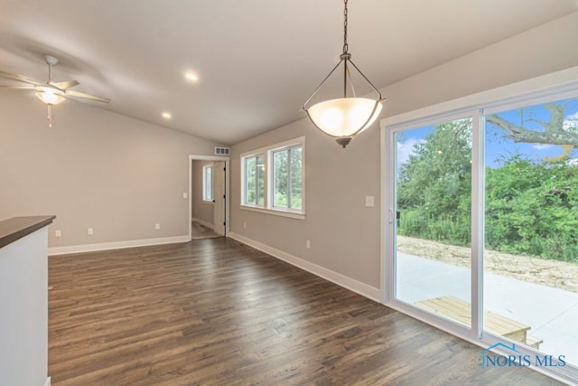 interior space with a ceiling fan, visible vents, baseboards, lofted ceiling, and dark wood-type flooring