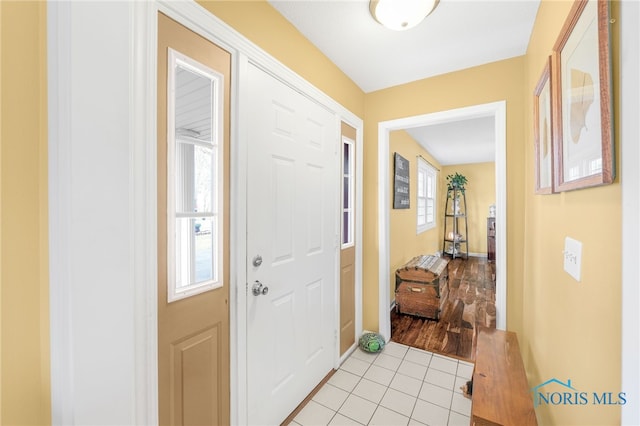 10132 Laplante Rd, Monclova, OH 43542 - foyer entrance featuring light tile patterned floors and baseboards