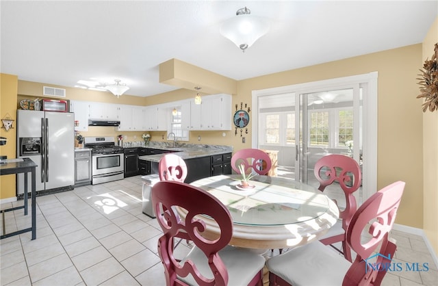 10132 Laplante Rd, Monclova, OH 43542 - dining room with light tile patterned flooring and baseboards