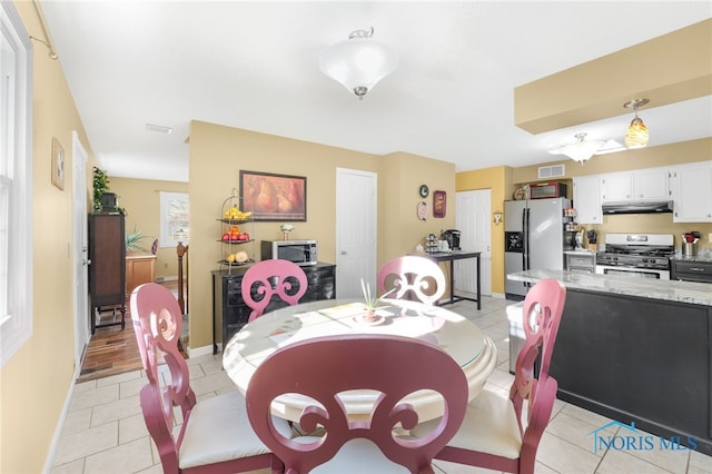 10132 Laplante Rd, Monclova, OH 43542 - dining area with light tile patterned flooring and baseboards
