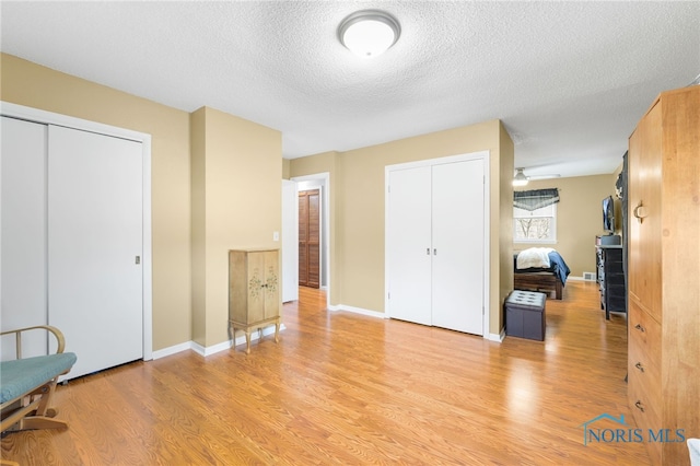 10132 Laplante Rd, Monclova, OH 43542 - unfurnished bedroom with light wood-type flooring and a textured ceiling