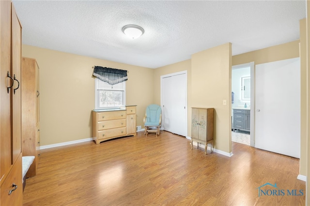 10132 Laplante Rd, Monclova, OH 43542 - unfurnished bedroom featuring light wood finished floors and a textured ceiling
