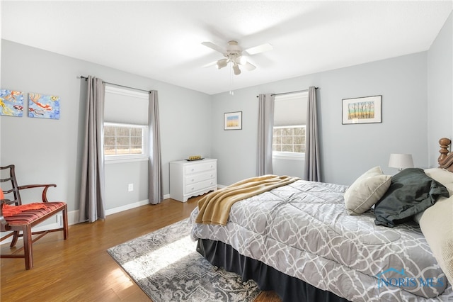 10132 Laplante Rd, Monclova, OH 43542 - bedroom with multiple windows, wood finished floors, and a ceiling fan
