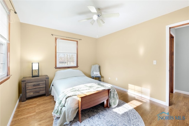 10132 Laplante Rd, Monclova, OH 43542 - bedroom with wood finished floors, multiple windows, and a ceiling fan