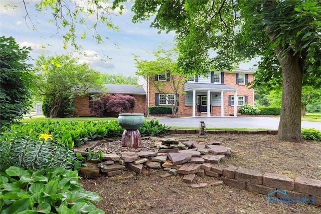 10132 Laplante Rd, Monclova, OH 43542 - rear view of house featuring brick siding