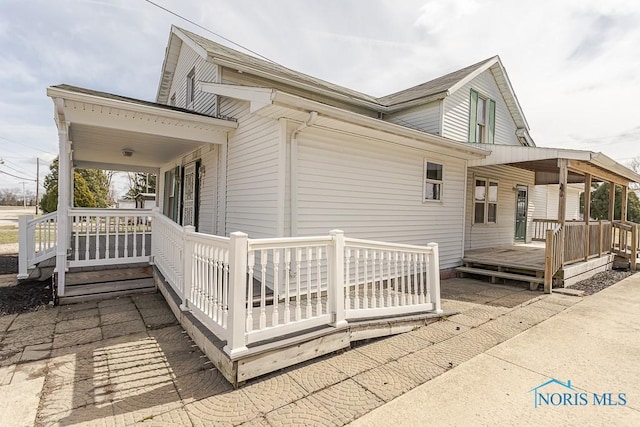 view of home's exterior featuring covered porch