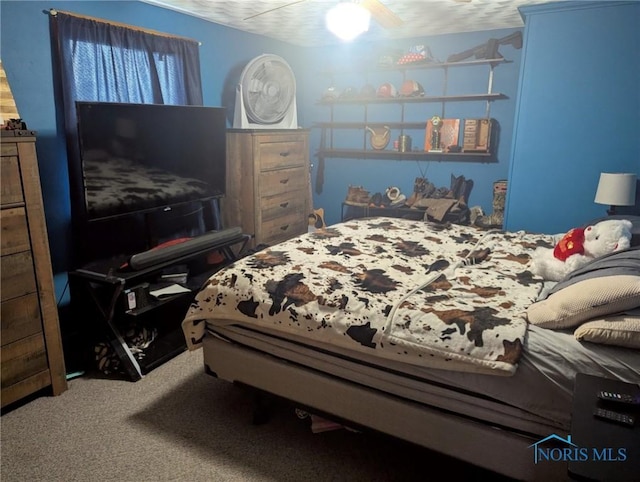carpeted bedroom featuring a ceiling fan