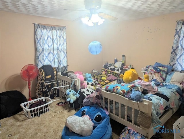 bedroom with carpet and a ceiling fan