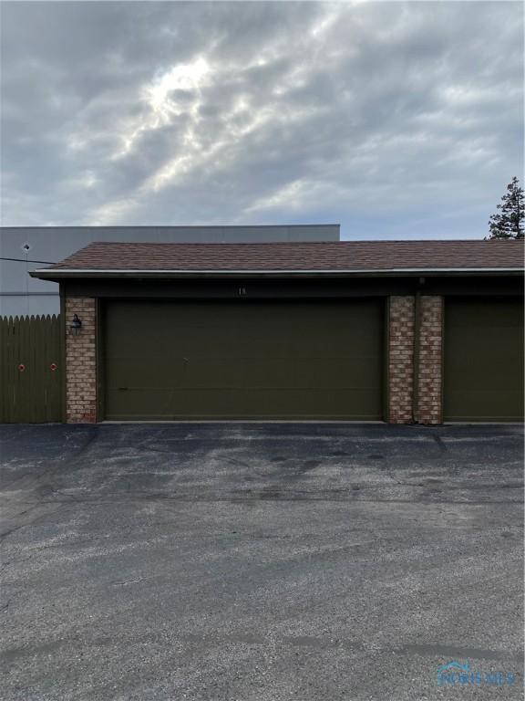 garage featuring fence