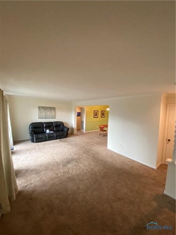 unfurnished living room featuring carpet