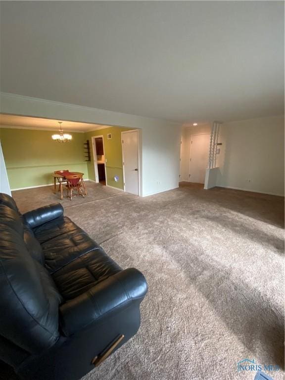living room featuring carpet floors and a chandelier