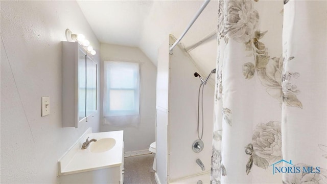bathroom with shower / bathtub combination, vanity, vaulted ceiling, and toilet