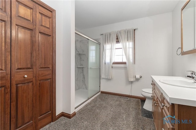 2121 County Road 4 Unit 1, Swanton, OH 43558 - bathroom with vanity, toilet, baseboards, and a stall shower