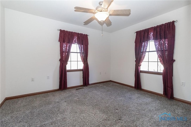2121 County Road 4 Unit 1, Swanton, OH 43558 - unfurnished room with visible vents, baseboards, ceiling fan, and carpet floors