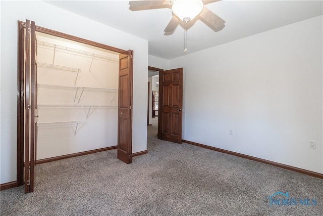 2121 County Road 4 Unit 1, Swanton, OH 43558 - unfurnished bedroom featuring a closet, baseboards, carpet, and a ceiling fan