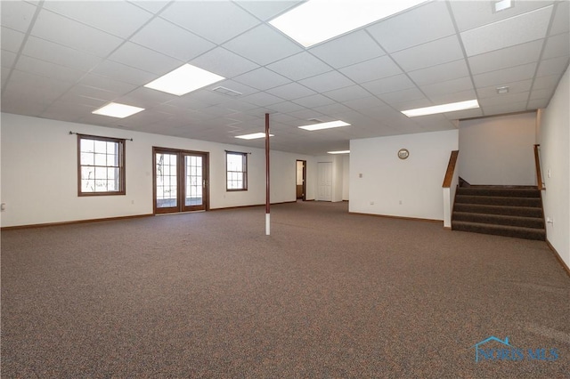 2121 County Road 4 Unit 1, Swanton, OH 43558 - basement with a drop ceiling, baseboards, carpet, and stairs