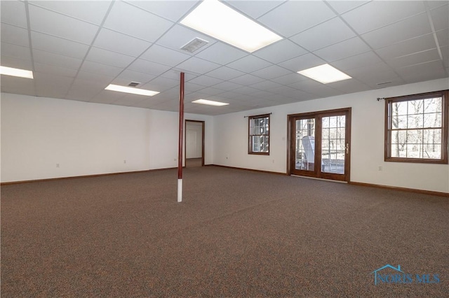 2121 County Road 4 Unit 1, Swanton, OH 43558 - below grade area featuring visible vents, baseboards, carpet, and a drop ceiling