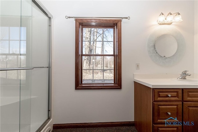 2121 County Road 4 Unit 1, Swanton, OH 43558 - full bathroom with vanity, baseboards, and a shower with shower door