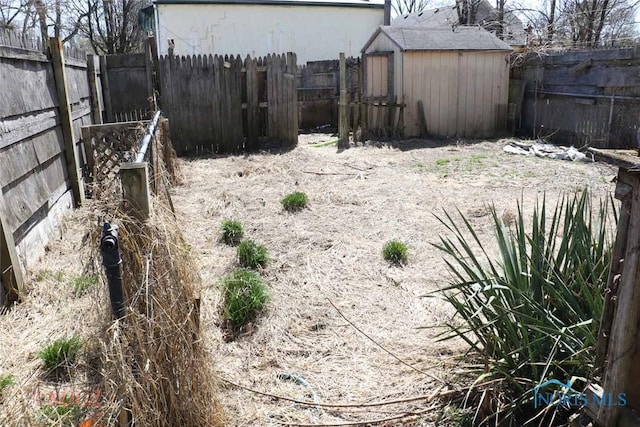 1142 Page St, Toledo, OH 43608 - fenced backyard with a shed and an outbuilding