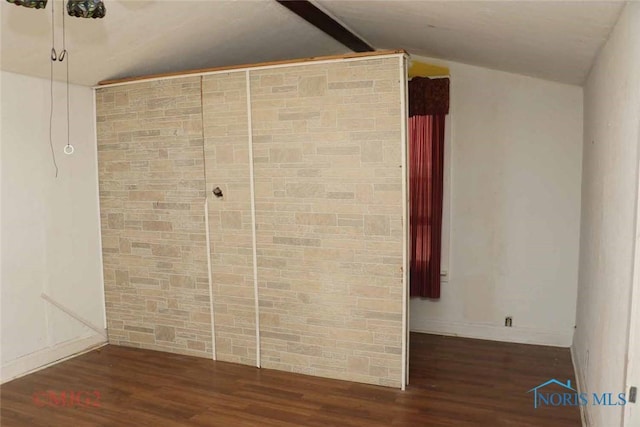 1142 Page St, Toledo, OH 43608 - empty room featuring vaulted ceiling, wood finished floors, and baseboards