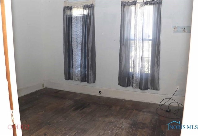 1142 Page St, Toledo, OH 43608 - empty room with hardwood / wood-style flooring and baseboards