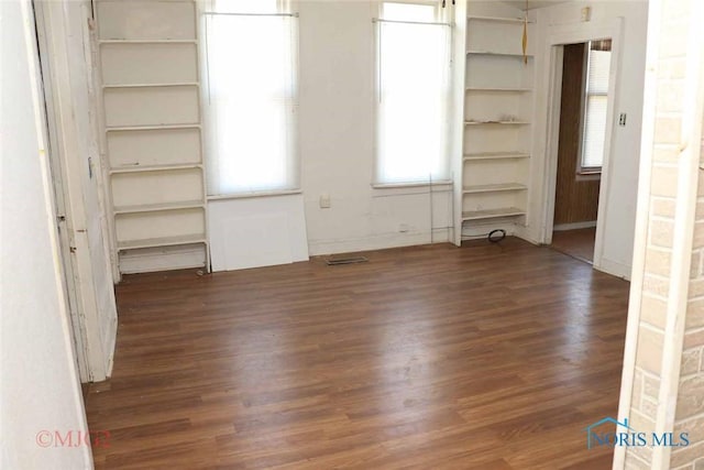 1142 Page St, Toledo, OH 43608 - spare room featuring wood finished floors and plenty of natural light