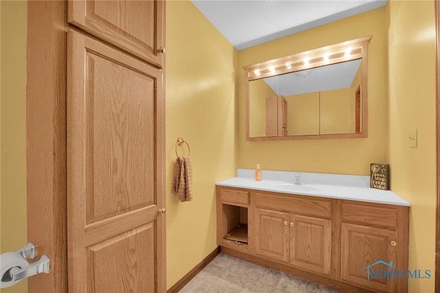 bathroom featuring vanity and baseboards