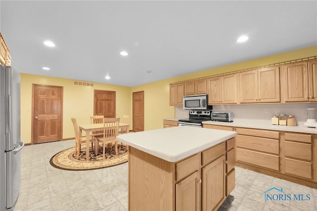 kitchen with visible vents, light brown cabinets, light countertops, recessed lighting, and appliances with stainless steel finishes