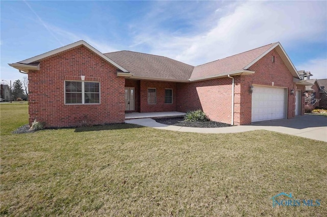 ranch-style home featuring a front lawn, a garage, brick siding, and concrete driveway