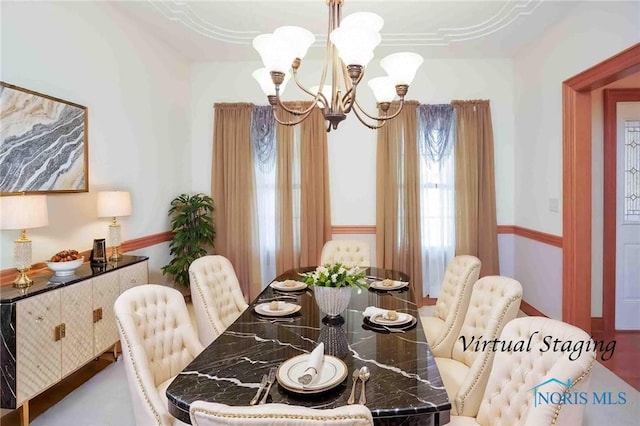 dining room featuring a chandelier