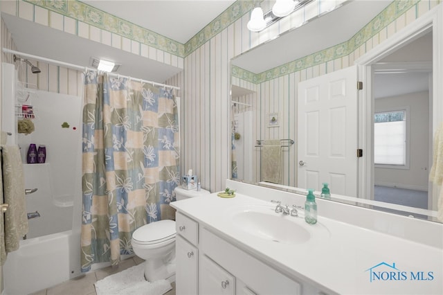 full bath with tile patterned flooring, shower / bathtub combination with curtain, vanity, toilet, and wallpapered walls