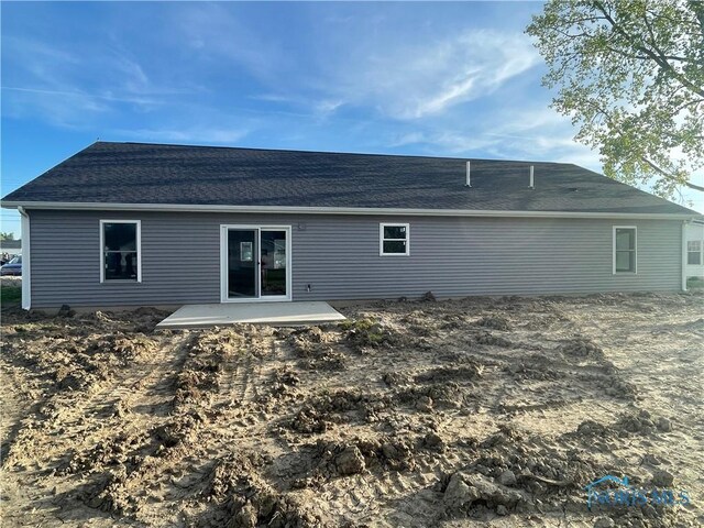 516 Ogen St, Hicksville, OH 43526 - back of property with a shingled roof and a patio