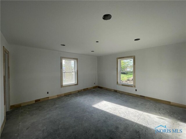 516 Ogen St, Hicksville, OH 43526 - spare room with healthy amount of natural light and baseboards