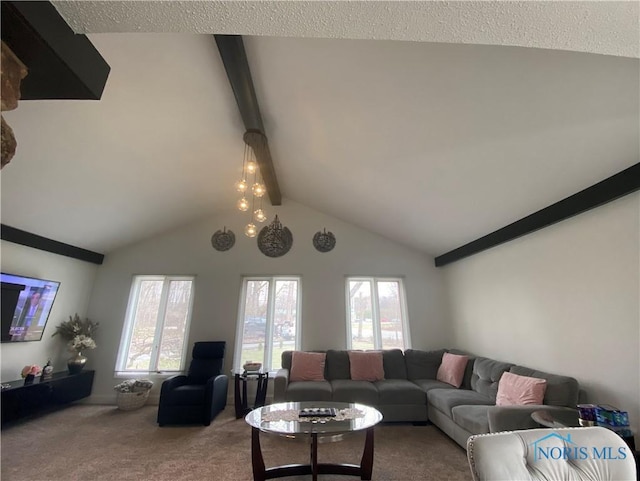 carpeted living area with lofted ceiling with beams and a wealth of natural light