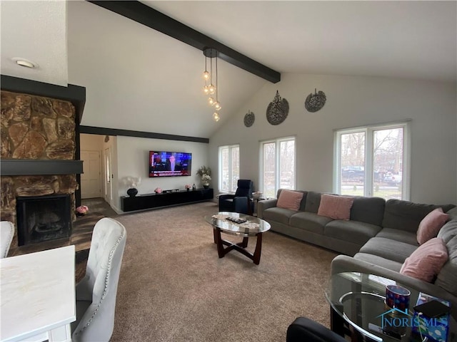 carpeted living room with a stone fireplace, high vaulted ceiling, and beam ceiling