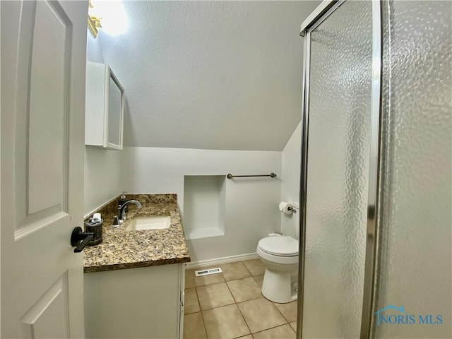 full bathroom with visible vents, a shower stall, toilet, tile patterned floors, and vanity