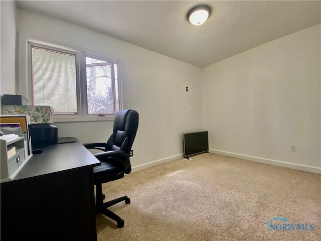 office area with baseboards and carpet floors