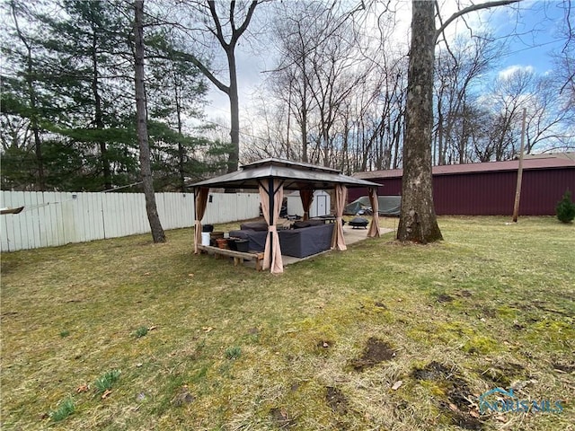 view of yard with a gazebo and fence