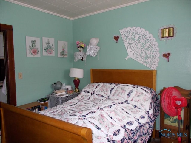 bedroom featuring crown molding