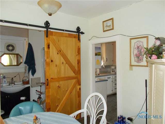 dining room featuring a barn door