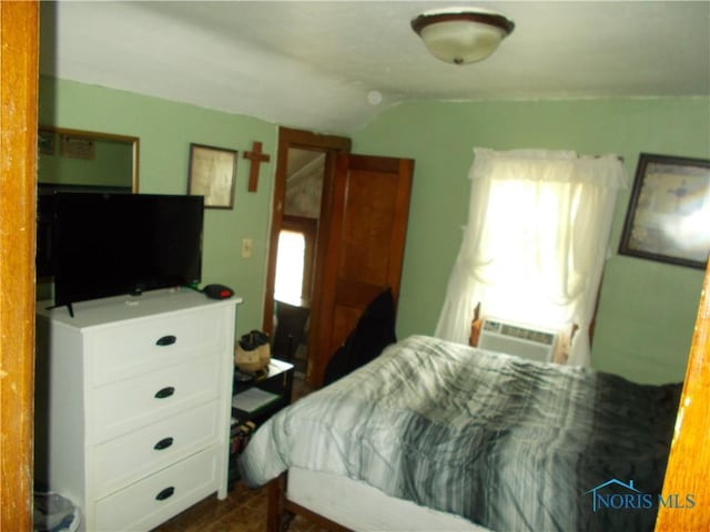 bedroom featuring lofted ceiling