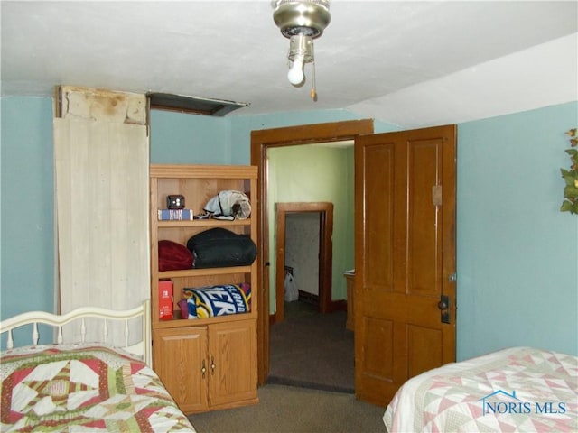 carpeted bedroom featuring lofted ceiling