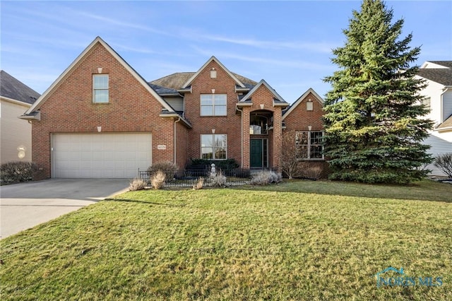 14579 Lake Meadows Dr, Perrysburg, OH 43551 - traditional-style home featuring driveway, brick siding, a garage, and a front yard