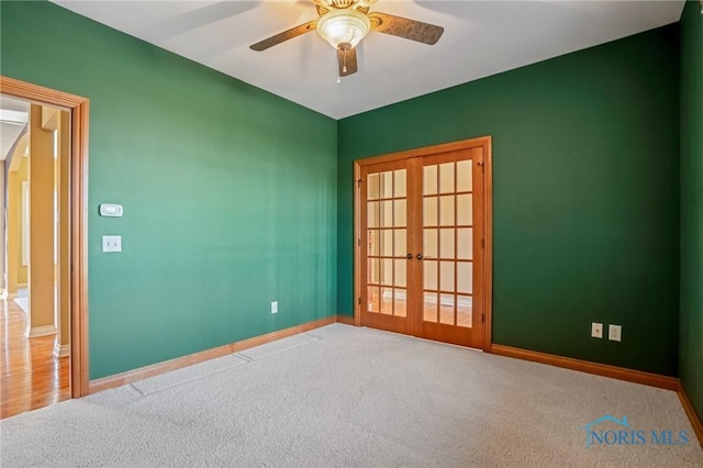 14579 Lake Meadows Dr, Perrysburg, OH 43551 - carpeted empty room featuring baseboards, arched walkways, ceiling fan, and french doors