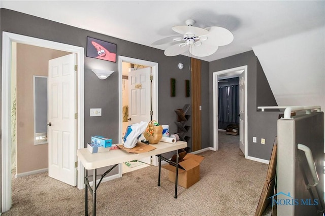 bedroom featuring baseboards and light colored carpet