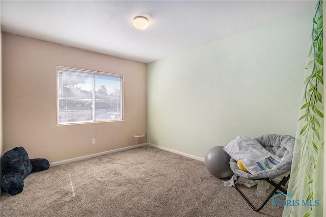 unfurnished room featuring baseboards and carpet