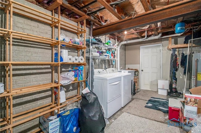 interior space with gas water heater and washer and dryer