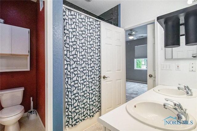 4014 Stonehenge Dr Unit 4014, Sylvania, OH 43560 - full bathroom with a ceiling fan, toilet, double vanity, a shower with curtain, and baseboards